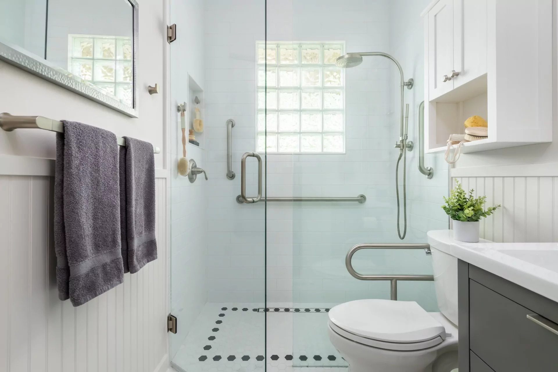 Barrier-free walk-in shower with hex tile from an accessible bathroom renovation in Toronto