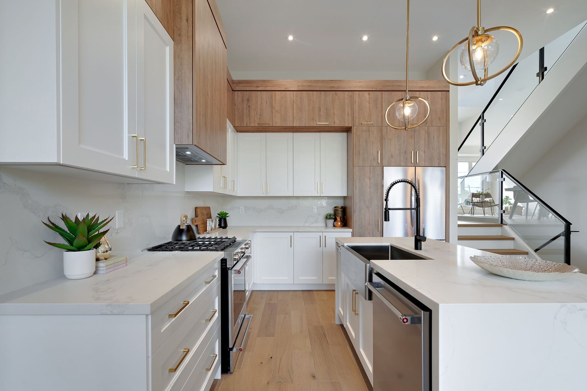 Open concept kitchen and living area in an Etobicoke custom home, kitchen and millwork by iNSEQUENCE