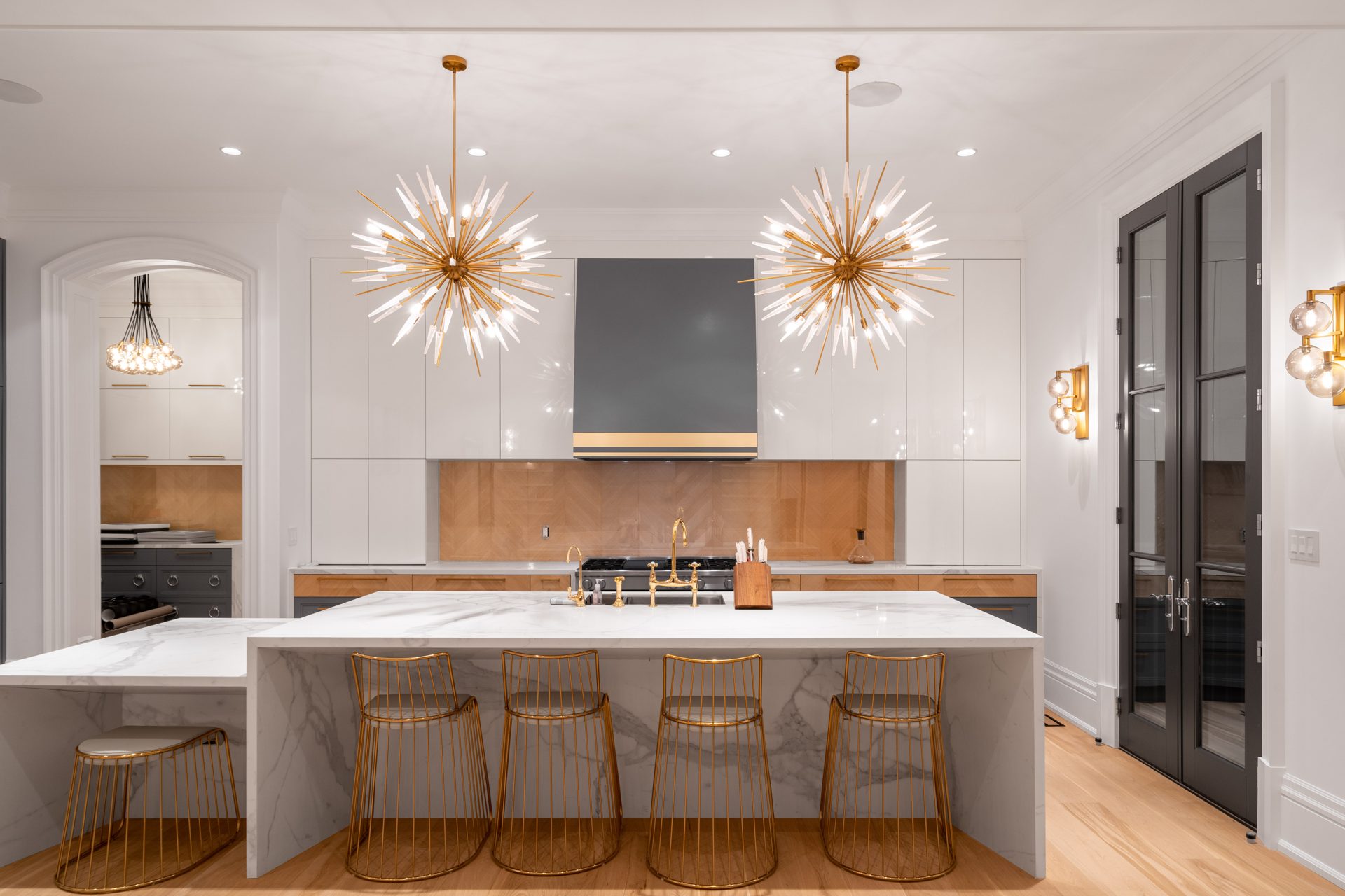 Chef's kitchen with marble island and custom millwork in a Thornhill custom home, kitchen and millwork by iNSEQUENCE