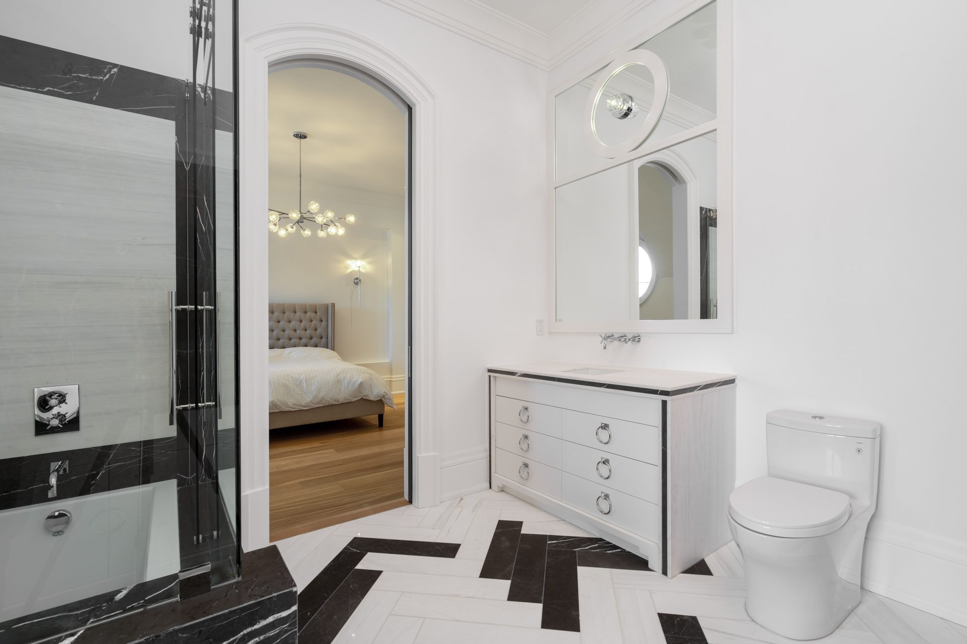 White furniture style vanity on a black and white herringbone marble floor, Thornhill ensuite