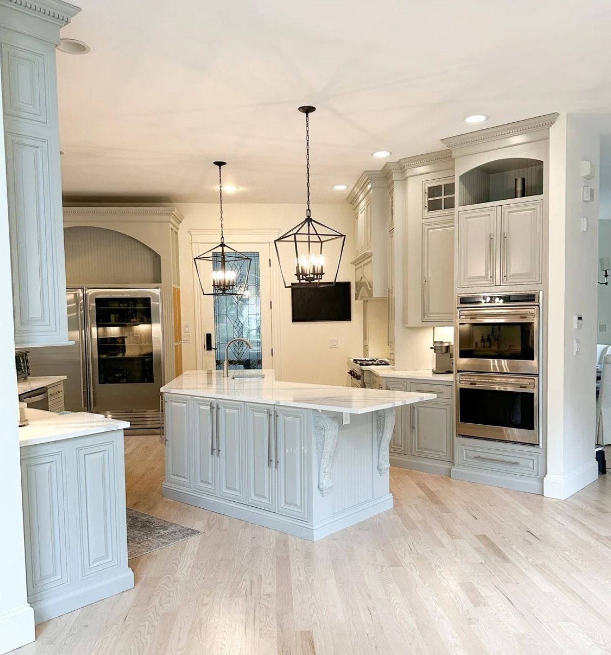 Traditional kitchen with furniture style island and lantern pendants from a selective kitchen renovation in Richmond Hill